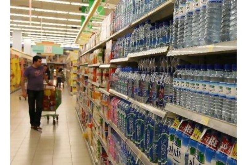 Bottled water on display in a supermarket is not expensive, but by the time it reaches your restaurant table the price has often increased sharply - a fact which angers letter writers. Pawan Singh / The National