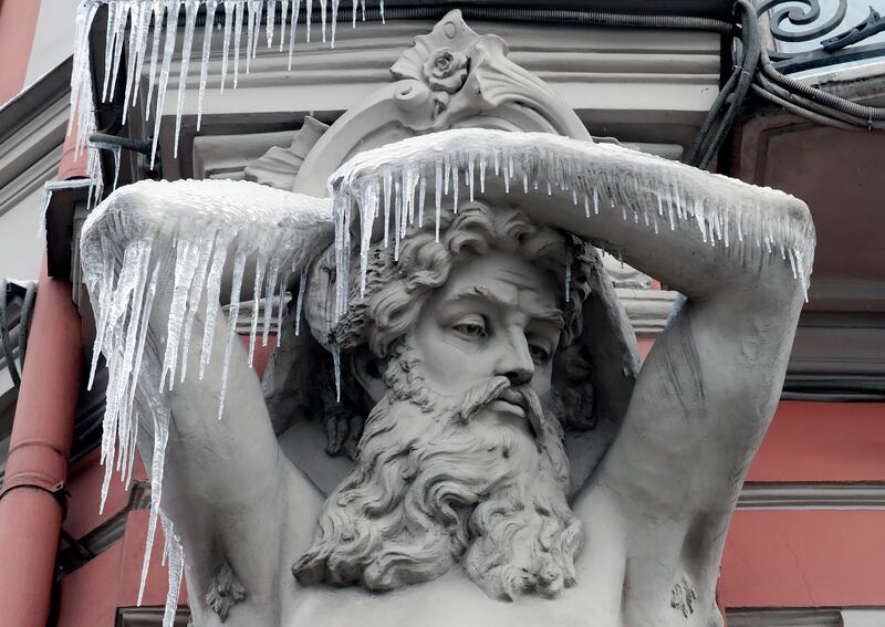 A sculpture of Atlant by the Danish sculptor David Jensen is covered with ice at the Beloselsky-Belozersky Palace in Saint Petersburg, Russia.   EPA 