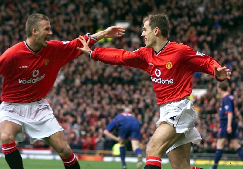Manchester United's Phil Neville (right), celebrates with teammate David Beckham after scoring in 2002. PA