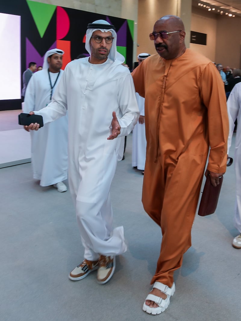Mohamed Al Mubarak, chairman of DCT — Abu Dhabi, arrives with Steve Harvey.