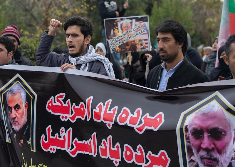 Pakistani Shiite Muslims protest over the U.S. airstrike in Iraq that killed Iranian Revolutionary Guard Gen. Qassem Soleimani, in Islamabad, Pakistan, Friday, Jan. 3, 2020. Iran has vowed "harsh retaliation" for the U.S. airstrike near Baghdad's airport that killed Tehran's top general and the architect of its interventions across the Middle East, as tensions soared in the wake of the targeted killing. Banner reads "Down with America, down with Israeil." (AP Photo/B.K. Bangash)