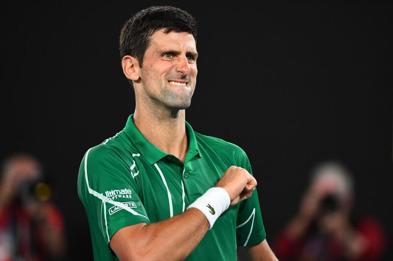 Serbia's Novak Djokovic celebrates after beating Switzerland's Roger Federer during their men's singles semi-final match on day eleven of the Australian Open tennis tournament in Melbourne on January 30, 2020. IMAGE RESTRICTED TO EDITORIAL USE - STRICTLY NO COMMERCIAL USE
 / AFP / William WEST / IMAGE RESTRICTED TO EDITORIAL USE - STRICTLY NO COMMERCIAL USE
