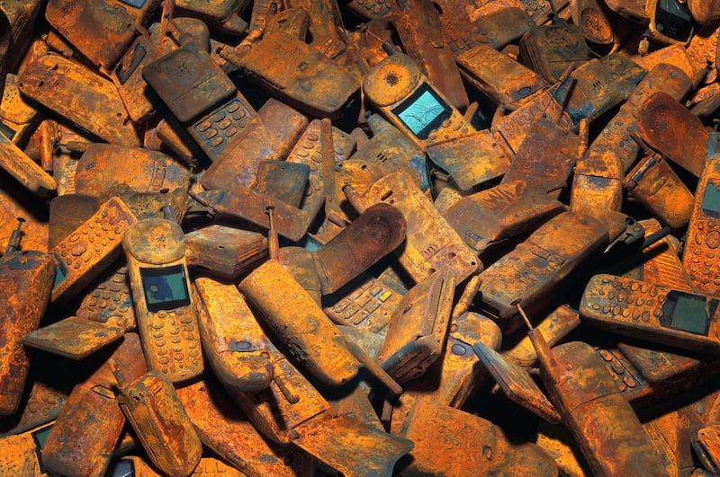 Discarded mobile phones can leak toxic chemicals into the ground. Getty