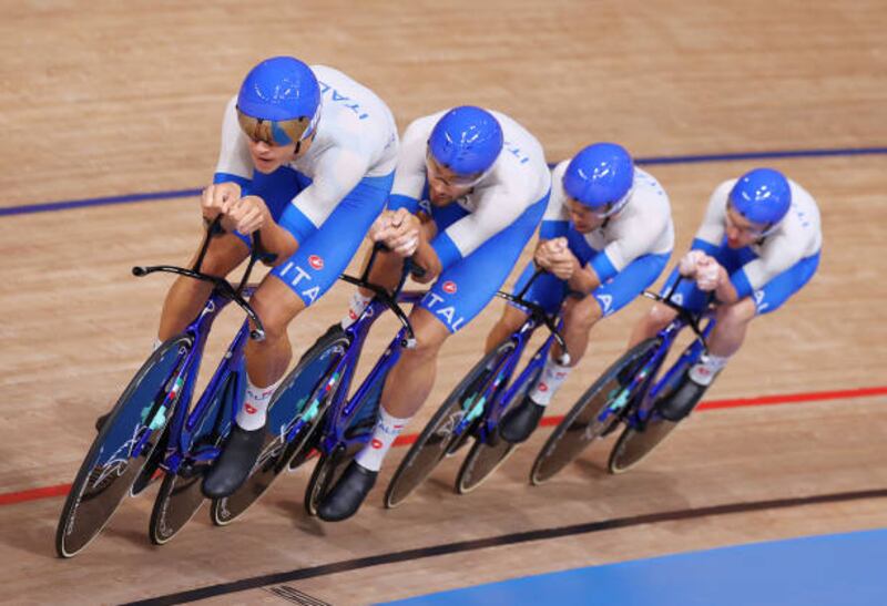 Simone Consonni, Filippo Ganna, Francesco Lamon and Jonathan Milan of Team Italy sprint to set a new world record during the Men's team pursuit finals, winning the gold medal in the process.