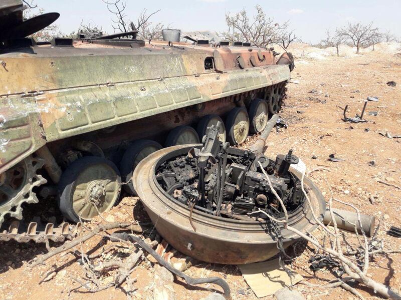 A damaged tank is seen in Idlib countryside, Syria in this handout released by SANA.  Reuters