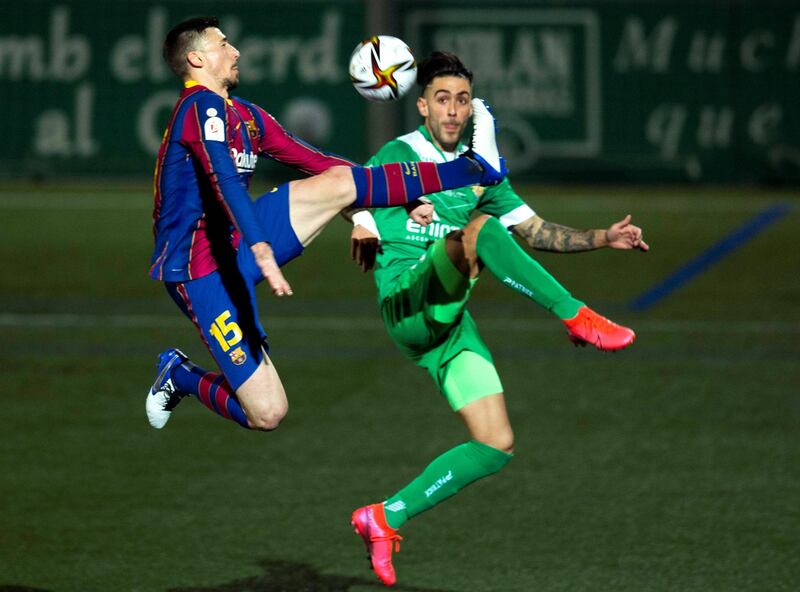 Barcelona's Clement Lenglet battles for the ball with Albert Estelles of Cornella. EPA