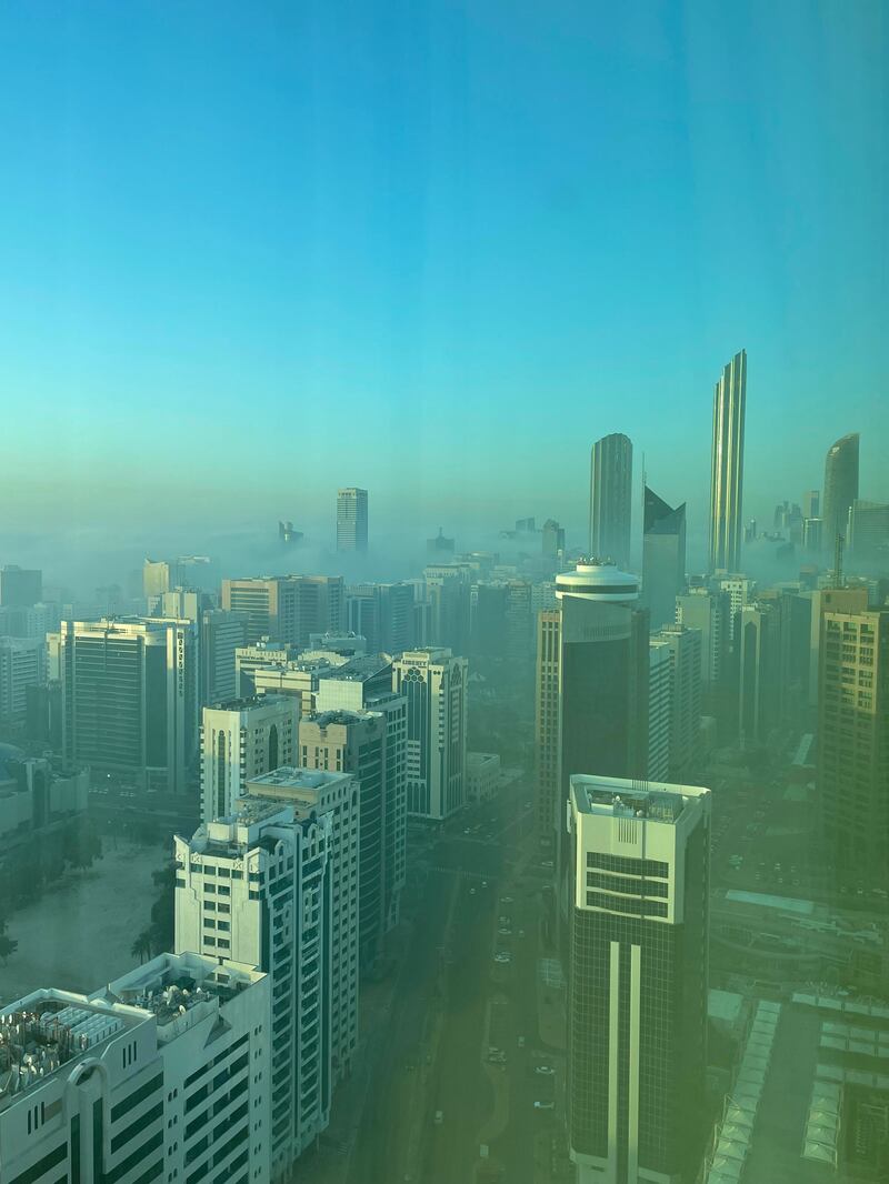 Fog rolls in over Abu Dhabi's city centre. Tim Knowles / The National