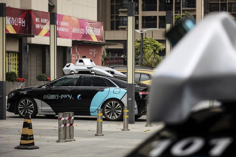 A Pony.ai Inc. autonomous vehicle sits parked on a sidewalk in the Nansha district of Guangzhou, Guangdong Province, China, on Wednesday, April 10, 2019. Domestic and foreign testers are putting cars, buses, trucks and delivery vans through self-driving trials to teach them how to navigate the notoriously congested streets of the world's biggest auto market. Photographer: Qilai Shen/Bloomberg