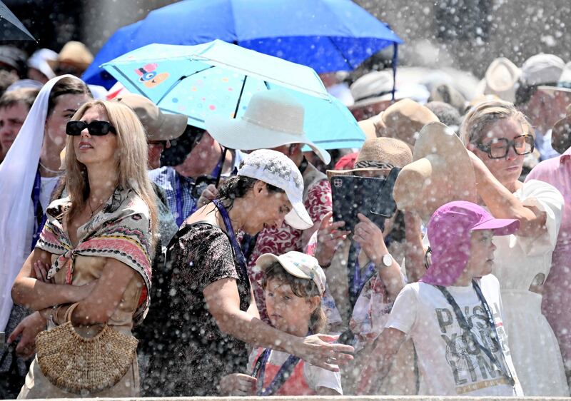 Cooling off in a fountain in St Peter's square, Vatican City. AFP