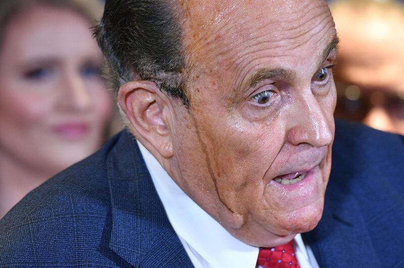 Trump's personal lawyer Rudy Giuliani perspires as he speaks during a press conference at the Republican National Committee headquarters in Washington, DC. AFP