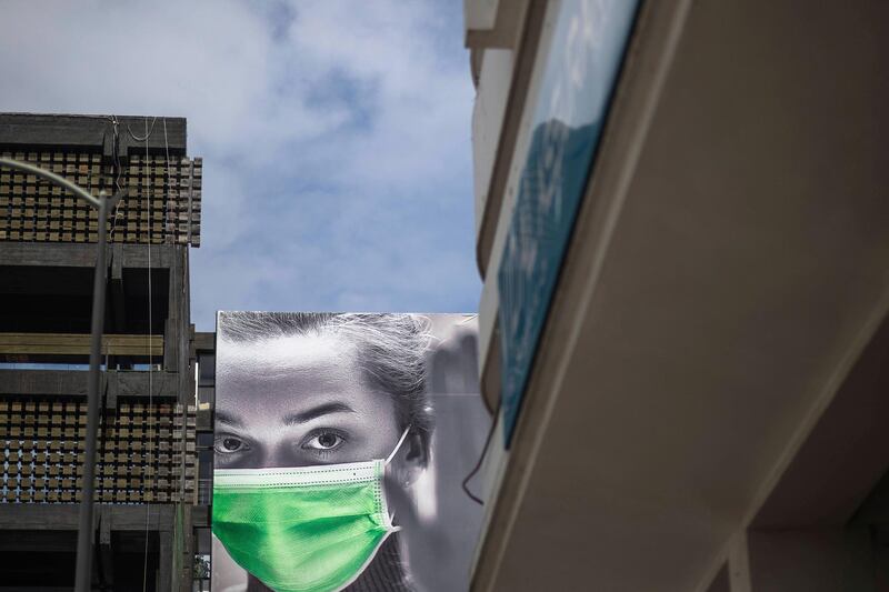 An ad spreading awareness against coronavirus is seen in Rabat, Morocco, Wednesday, April 22, 2020. The new coronavirus causes mild or moderate symptoms for most people, but for some, especially older adults and people with existing health problems, it can cause more severe illness or death. (AP Photo/Mosa'ab Elshamy)