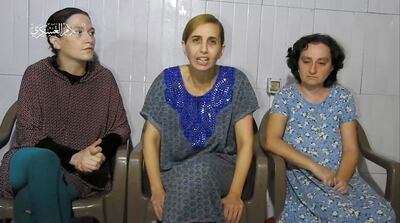 Three Israeli women, identified by Prime Minister Benjamin Netanyahu as Yelena Trupanob, Danielle Aloni and Rimon Kirsht, who are held captive by Hamas in Gaza give a statement in a video. Reuters