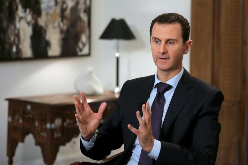 Syrian president Bashar Al Assad gestures during an exclusive interview with Agence France-Presse in the capital Damascus on February 11, 2016. Joseph Eid/AFP 