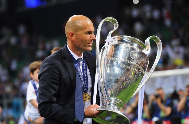 MILAN, ITALY - MAY 28:  Zinedine Zidane manager of Real Madrid
poses with the trophy after winning the UEFA Champions League Final between Real Madrid and Club Atletico de Madrid at Stadio Giuseppe Meazza on May 28, 2016 in Milan, Italy.  (Photo by Denis Doyle - UEFA/UEFA via Getty Images)