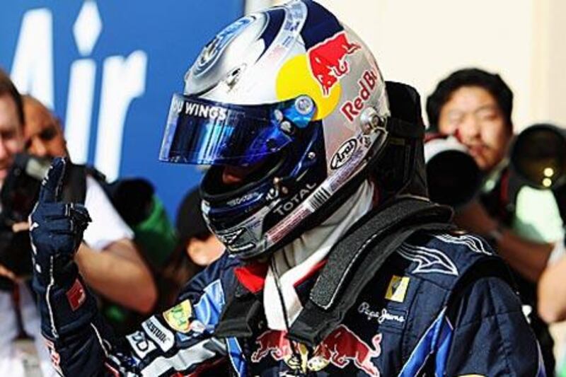 Sebastian Vettel of Red Bull Racing celebrates taking pole position in Sakhir yesterday.