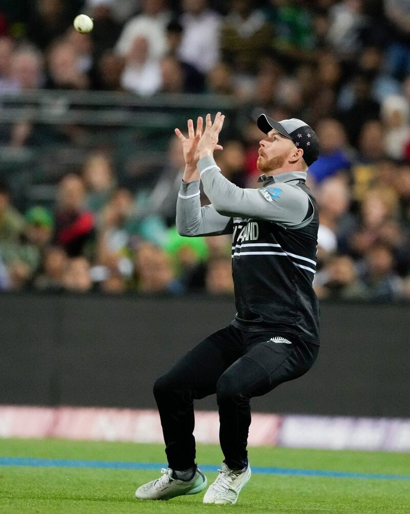 New Zealand's Glenn Phillips takes a catch to dismiss Pakistan batter Mohammad Rizwan. AP