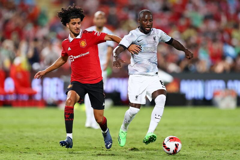 Naby Keita of Liverpool controls the ball against Zidane Iqbal of Manchester United. Getty 