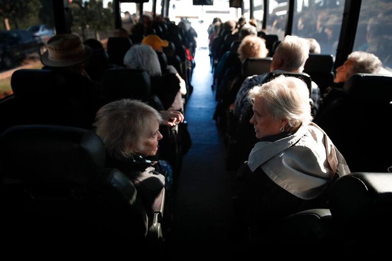 In this Feb. 19, 2019 photo, two seniors, Adele Frascella, left, and Donna Miller chat in a free shuttle bus on the way back to their retirement community after visiting Bud and Bloom cannabis dispensary in Santa Ana, Calif. As legal cannabis has spread to dozens of states, more Americans in their 70s and 80s are adding marijuana to the roster of senior activities such as golf and bingo. (AP Photo/Jae C. Hong)