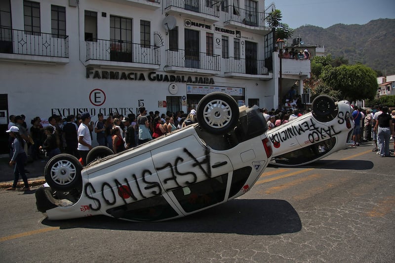 A street is blocked during a protest against the kidnapping and murder of eight-year-old Camila Gomez in Taxco de Alarcon, Mexico. The alleged perpetrators were lynched by members of the community. EPA