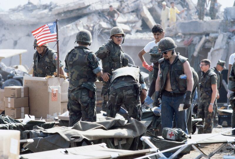 US marines search for survivors and bodies in their barracks in Beirut after a deadly car bombing in October 1983. Getty