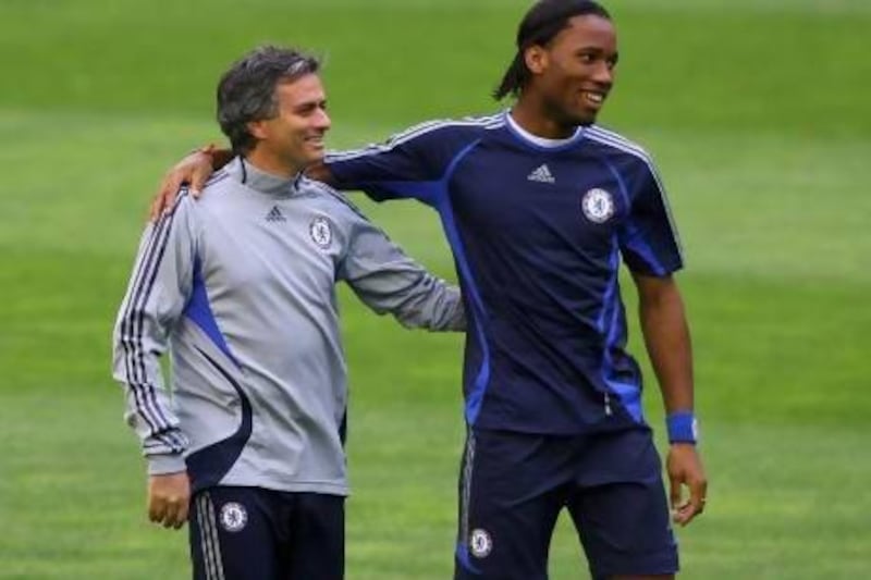 Coach Jose Mourinho, left, and Didier Drogba spent three memorable years together at Chelsea but will be on opposite sides tonight. Stu Forster / Getty Images