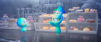 This image released by Disney-Pixar shows the character 22, voiced by Tina Fey, left, and Joe Gardner, voiced by  Jamie Foxx, in a scene from the animated film "Soul." (Disney Pixar via AP)