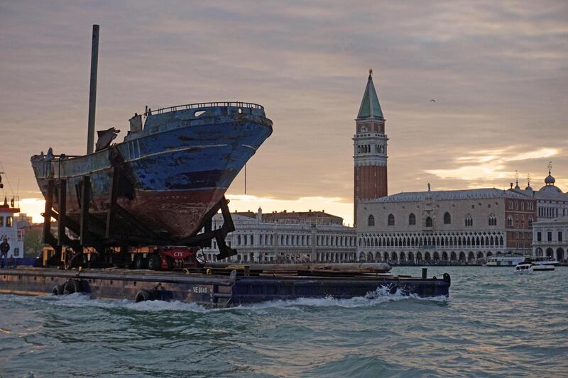 epa07551783 The arrival of the Icelandic Christoph Bucher artwork 'Barca Nostra', the fishing boat with 700 migrants on board which sank in the Mediterranean Sea in 2015, in Venice, northern Italy, 06 May 2019. The boat will become an artistic installation within the 58th Biennale of Art that runs from 11 may to 24 November.  EPA/ANDREA MEROLA