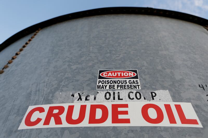 A sticker reads crude oil on the side of a storage tank in the Permian Basin in Mentone, Loving County, Texas. Oil prices have gained about 50 per cent since the start of the year as countries press on with vaccination programmes and major economies reopen. REUTERS