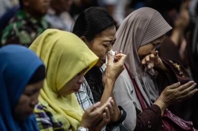 JAKARTA, INDONESIA - NOVEMBER 05: Families of victims of Lion Air flight JT 610 weeps as they meeting with authorities and Lion Air management on November 5, 2018 in Jakarta, Indonesia. Indonesian officials said they have downloaded the data from a black box recorder for Lion Air flight 610 which crashed into Java sea last week while at least 105 body bags containing parts of passengers have been handed to the national police hospital in Jakarta for identification. All 189 passengers and crew for the Boeing 737 are feared dead after the plane crashed shortly after takeoff as investigators and agencies from around the world continue its week-long search for the main wreckage and cockpit voice recorder which might solve the mystery. (Photo by Ulet Ifansasti/Getty Images)