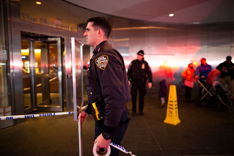A New York Police Department officer closes the entrance of the museum.  AFP