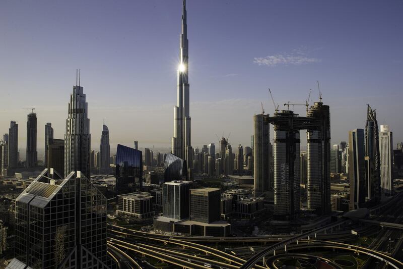 The Burj Khalifa tower, center, stands among city skyscrapers and the Address Sky View, right, under construction by developers Emaar Properties PJSC, in Dubai, United Arab Emirates, on Wednesday, April 11, 2018. Transformed into a flamboyant city state from an impoverished Gulf port in less than 50 years, Dubai defied geology to build skyscrapers and elaborately shaped islands in the sea. Photographer: Christopher Pike/Bloomberg