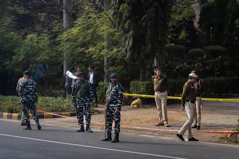 Delhi Police officers and paramilitary soldiers stand guard near the Israeli Embassy in New Delhi, India. AP