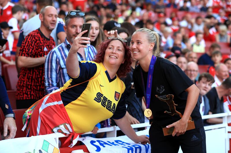 Arsenal and England's Beth Mead with fans at the Emirates Stadium. PA