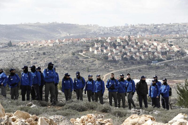 Israeli security forces gather at the Amona outpost, northeast of Ramallah, as they prepare to evict  Jewish occupants.  Jack Guez / AFP