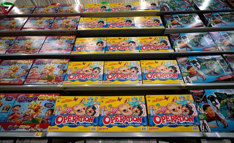 FILE- In this Nov. 9, 2018, file photo Operation made by Hasbro is displayed shelves in the expanded toy section at a Walmart Supercenter in Houston. Shares of Hasbro are plunging after the company said the trade war is hammering its supply chain. The toymaker on Tuesday reported third-quarter net income of $212.9 million, or $1.67 per share. (AP Photo/David J. Phillip, File)