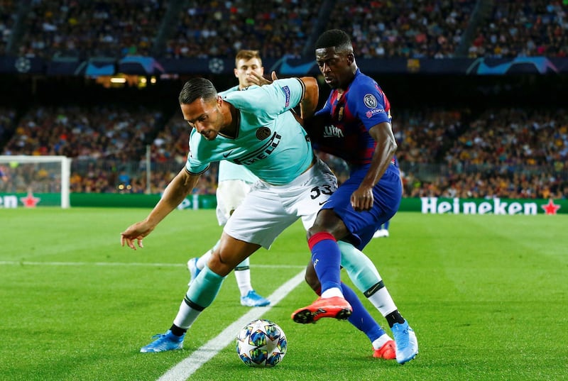 Ousmanne Dembele (R) in action against Danilo DÂ´Ambrossio (L) of Inter during the UEFA Champions League group F soccer match between FC Barcelona and FC Internazionale at Camp Nou Stadium in Barcelona, Catalonia, Spain, 02 October 2019.  EPA/Enric Fontcuberta