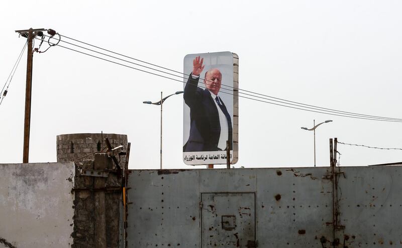 A picture taken on August 9, 2018 during a trip in Yemen organised by the UAE's National Media Council (NMC) shows a poster of Yemen's Saudi and UAE-backed President Abedrabbo Mansour Hadi on a billboard in the country's second city of Aden. (Photo by KARIM SAHIB / AFP)