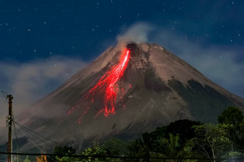 A long-exposure photo shows Mount Merapi in Indonesia spewing lava onto its slopes during an eruption. AFP