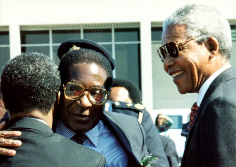 SOUTH AFRICA - AUGUST 01:  South Africa. President of Zimbabwe, Robert Mugabe, pictured with President Nelson Mandela in South Africa during a state visit.  (Photo by Media24/Gallo Images/Getty Images)