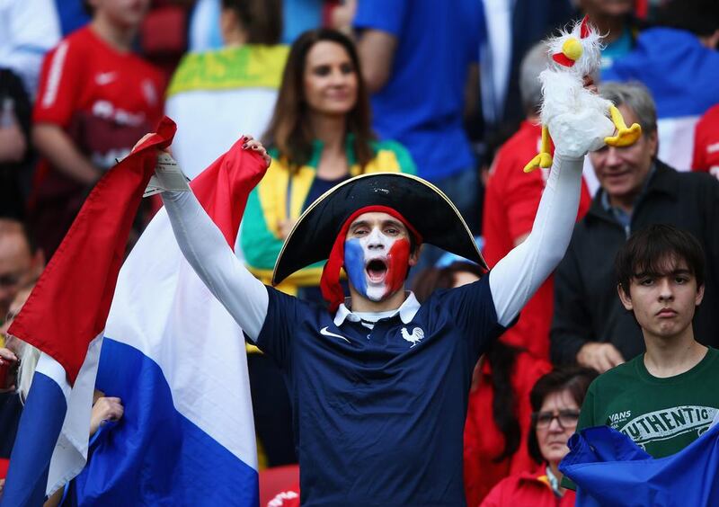 A France fan cheers in Porto Alegre, Brazil. Ian Walton / Getty Images