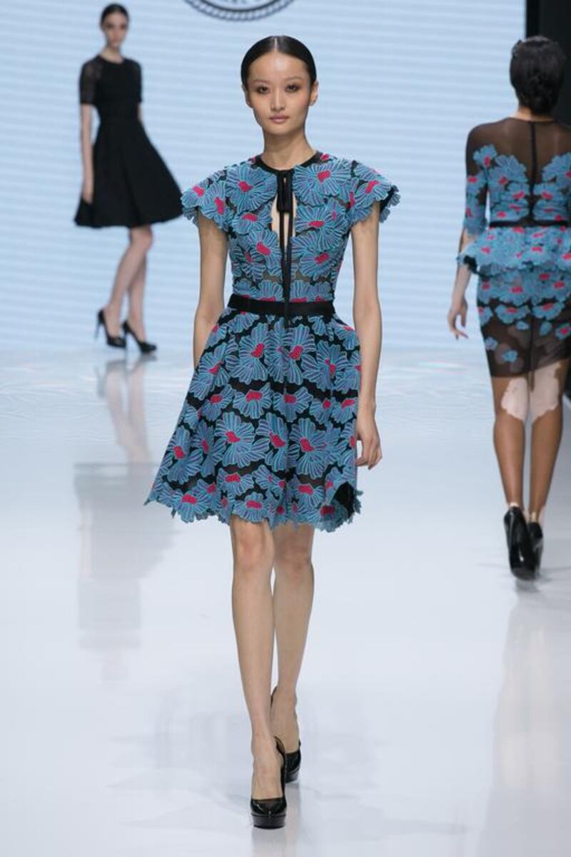 Cerulean applique flowers on black was one of the several floral themes. Courtesy Michael Cinco and Couturissimo