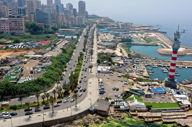 A picture taken with a drone shows anti-government protesters wave Lebanese flags as they driving through the streets to protest the economic situation at Corniche Al Manara in Beirut, Lebanon.  EPA