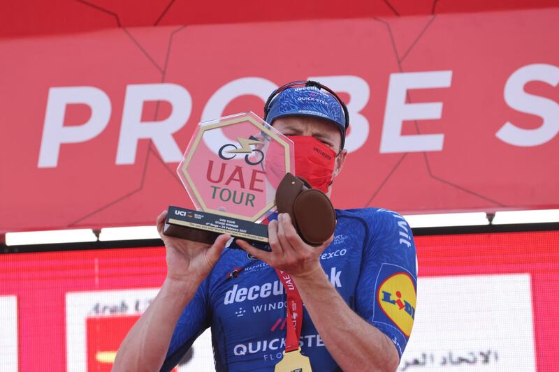 Sam Bennet celebrates victory on the podium. AFP