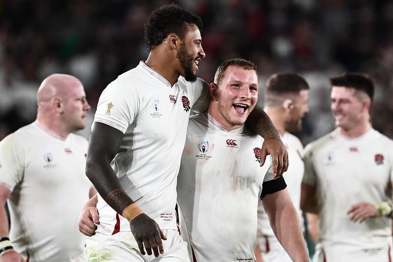 Courtney Lawes, left, and Sam Underhill celebrate after the match. AFP