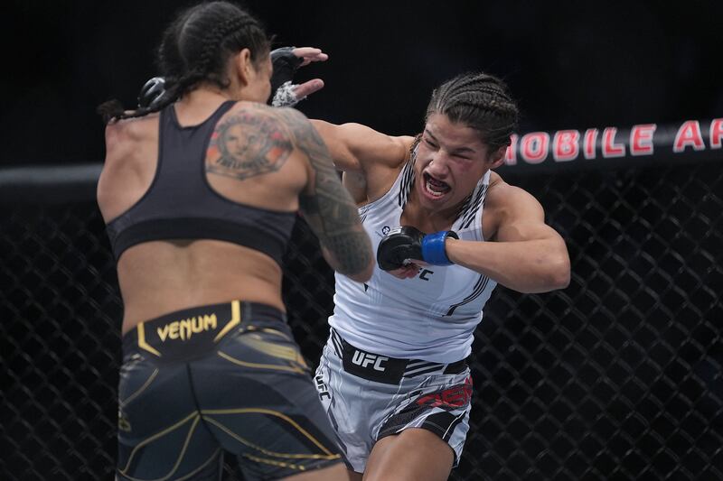 Julianna Pena moves in with a hit against Amanda Nunes. Reuters