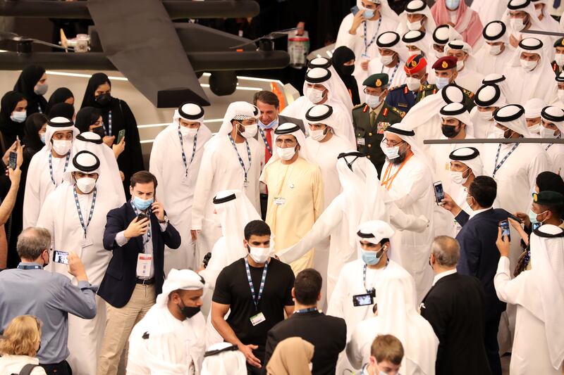 Sheikh Mohammed bin Rashid and Sheikh Hamdan bin Mohammed tour the Edge stand on the second day of the Dubai airshow 2021. Chris Whiteoak/ The National