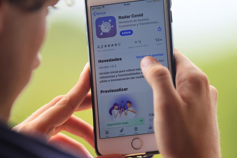 A user downloads an app aimed at detecting and collecting data to avoid new surges on the spread of the disease, in Palma de Mallorca, Balearic Islands, Spain. EPA