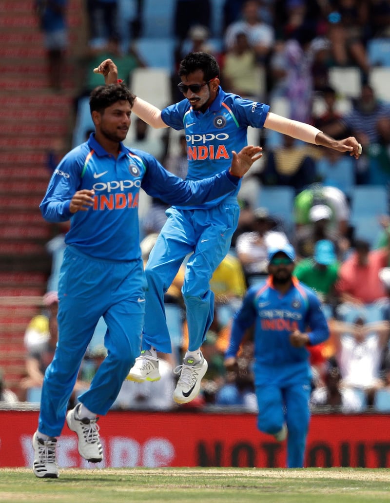 India's bowler Kuldeep Yadav, left, celebrates with teammate Yuzvendra Chahal after taking a third wicket of South Africa's batsman Kagiso Rabada, during the second One Day International cricket match between South Africa and India at Centurion Park in Pretoria, South Africa, Sunday, Feb. 4, 2018. (AP Photo/Themba Hadebe)