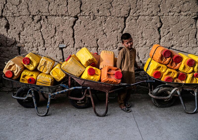 Women and children are usually given the job of fetching water in drought-hit parts of Afghanistan. AFP