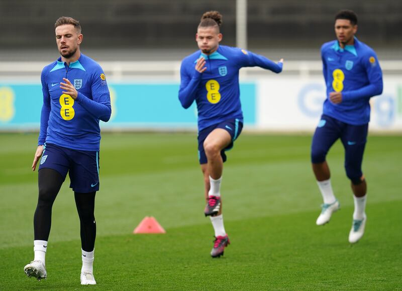 England's Jordan Henderson, Kalvin Phillips and Jude Bellingham during training. PA